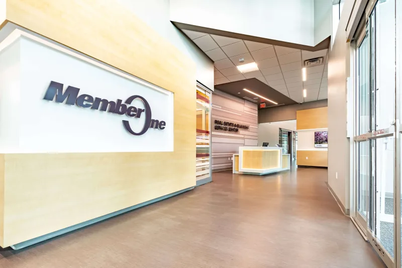 The main entrance and service desk inside the Member One Federal Credit Union Service Center in Roanoke, Virginia.